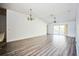 Bright living room featuring hardwood floors and ceiling fan at 12600 Jillian Cir, Hudson, FL 34669