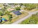 Aerial view of a house, backyard, and pool at 13474 Tune Ln, Spring Hill, FL 34609