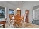 Cozy dining area with wooden table and chairs near kitchen at 13474 Tune Ln, Spring Hill, FL 34609