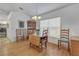 Bright dining room with wooden table and chairs near kitchen at 13474 Tune Ln, Spring Hill, FL 34609