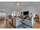 Bright living room with hardwood floors, neutral color palette, and plenty of natural light at 13474 Tune Ln, Spring Hill, FL 34609