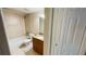 Bathroom features tub, toilet and granite vanity at 2860 Somerset Park Dr # 203, Tampa, FL 33613