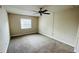 Spacious bedroom with carpeted floor and window coverings at 2860 Somerset Park Dr # 203, Tampa, FL 33613