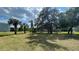 Landscaped grounds with mature trees and grassy areas at 2860 Somerset Park Dr # 203, Tampa, FL 33613