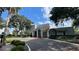 Community clubhouse with lush landscaping and inviting entrance at 2860 Somerset Park Dr # 203, Tampa, FL 33613