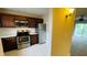 Modern kitchen with stainless steel appliances and wood cabinets at 2860 Somerset Park Dr # 203, Tampa, FL 33613