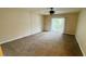 Large living room with carpeted floors and sliding glass doors at 2860 Somerset Park Dr # 203, Tampa, FL 33613