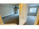 Spacious living room with carpeted floors and ceiling fan at 2860 Somerset Park Dr # 203, Tampa, FL 33613