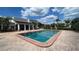 Community pool with adjacent clubhouse and plenty of sunshine at 2860 Somerset Park Dr # 203, Tampa, FL 33613