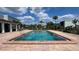 Large rectangular community pool with brick deck and clubhouse view at 2860 Somerset Park Dr # 203, Tampa, FL 33613