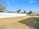 Large backyard with a white fence at 6941 Twilite Dr, Port Richey, FL 34668