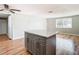 Living room features hardwood floors and kitchen island at 6941 Twilite Dr, Port Richey, FL 34668