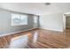 Bright living room with hardwood floors and a window at 6941 Twilite Dr, Port Richey, FL 34668