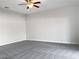 Spacious living room featuring ceiling fan and carpet at 16617 Magnolia Reserve Pl, Wimauma, FL 33598