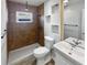 Updated bathroom with walk-in shower and built-in shelves at 2956 Laurel Ct, Dunedin, FL 34698