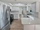 Modern kitchen with white cabinets and quartz counters at 2956 Laurel Ct, Dunedin, FL 34698