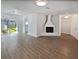 Open living area with hardwood floors and fireplace at 2956 Laurel Ct, Dunedin, FL 34698