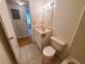 Clean bathroom with vanity, toilet, and a view of hardwood floor at 4034 Dream Oak Pl # 104, Tampa, FL 33613