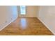 Spacious bedroom featuring light wood flooring and large windows at 4034 Dream Oak Pl # 104, Tampa, FL 33613