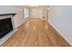 Living area with hardwood floors and fireplace at 4034 Dream Oak Pl # 104, Tampa, FL 33613