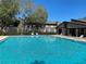 Refreshing community pool with ample lounge chairs at 4034 Dream Oak Pl # 104, Tampa, FL 33613