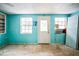 Empty bedroom with light blue walls and two windows at 4119 Beacon Square Dr, Holiday, FL 34691