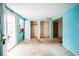 Empty bedroom with light blue walls and access to exterior at 4119 Beacon Square Dr, Holiday, FL 34691