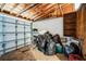 Garage with storage shelves and large trash bags at 4119 Beacon Square Dr, Holiday, FL 34691