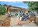 Side view of a house with cluttered yard and driveway at 4119 Beacon Square Dr, Holiday, FL 34691