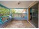 Empty screened porch with painted walls and concrete floor at 4119 Beacon Square Dr, Holiday, FL 34691