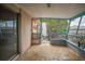 Empty screened porch with painted walls and concrete floor at 4119 Beacon Square Dr, Holiday, FL 34691