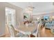 Dining room with a chandelier and view of living room at 7213 19Th W Ave, Bradenton, FL 34209