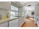 Kitchen with light cabinets and view of dining area at 7213 19Th W Ave, Bradenton, FL 34209