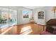 Living room with hardwood floors, window, and built-in shelving at 7213 19Th W Ave, Bradenton, FL 34209