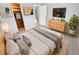 Bright bedroom with a queen-size bed and large closet at 1414 Wickham Ln, Holiday, FL 34691