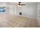 Open living area with tile flooring and plenty of natural light at 1414 Wickham Ln, Holiday, FL 34691