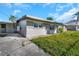 Side view of the house, showing the backyard and a partial view of the driveway at 4507 Cottonwood Dr, New Port Richey, FL 34652