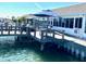 Spacious waterfront deck with seating and umbrella at 514 Boca Ciega Point N Blvd, St Petersburg, FL 33708