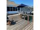 Waterfront deck with patio furniture and umbrella at 514 Boca Ciega Point N Blvd, St Petersburg, FL 33708