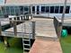 Wooden dock with ladder access to the water at 514 Boca Ciega Point N Blvd, St Petersburg, FL 33708