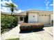 Inviting exterior with well-manicured landscaping and a two-car garage at 514 Boca Ciega Point N Blvd, St Petersburg, FL 33708