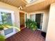 Welcoming front entry featuring tiled flooring and a wood front door at 514 Boca Ciega Point N Blvd, St Petersburg, FL 33708