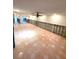 Large living room with tiled floors, currently under renovation at 514 Boca Ciega Point N Blvd, St Petersburg, FL 33708
