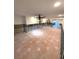 Large living room with tiled floors, currently under renovation at 514 Boca Ciega Point N Blvd, St Petersburg, FL 33708