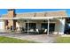 Covered patio with brick fireplace and seating at 514 Boca Ciega Point N Blvd, St Petersburg, FL 33708