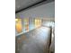 Large sunroom with multiple glass doors and vinyl flooring at 514 Boca Ciega Point N Blvd, St Petersburg, FL 33708