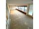 Sunroom with large windows and deck view, ready for new flooring at 514 Boca Ciega Point N Blvd, St Petersburg, FL 33708