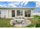 Backyard with stone patio and seating at 11095 56Th N Ave, Seminole, FL 33772