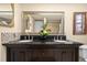 Double vanity bathroom with dark wood cabinets at 11095 56Th N Ave, Seminole, FL 33772