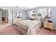 Bright bedroom with double bed and mirrored dresser at 11095 56Th N Ave, Seminole, FL 33772